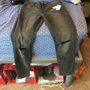 Ripped knee skinny jeans